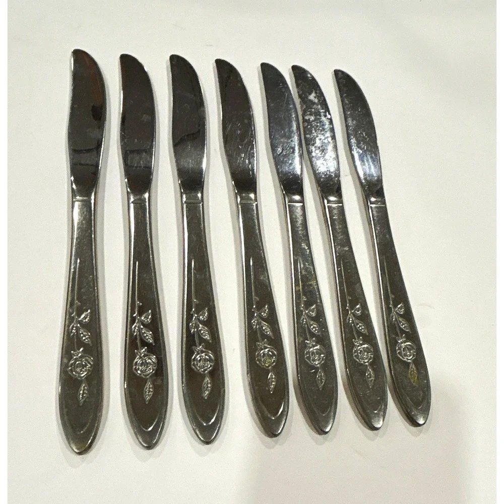 Set of 7 Oneida community stainless dinner knives in the pattern my rose